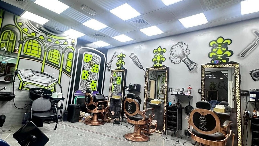 Vibrant interior of Glowing Gents Salon and Spa, Dubai, Dubai, AE with artistic wall designs and modern chairs.