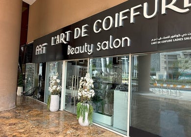 Entrance of L'Art de Coiffure Salon in Dubai, Dubai, AE with stylish decor.