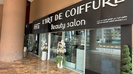 Entrance of L'Art de Coiffure Salon, a chic beauty spot in Dubai, Dubai, AE, showcasing elegant decor.