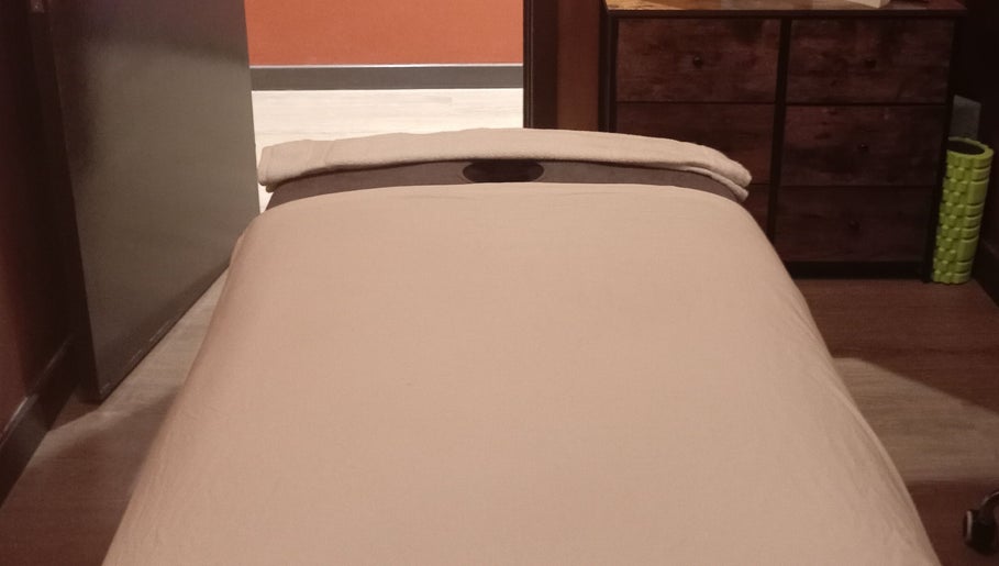 Massage table in a peaceful room at Essential Bodywork by Sara Colautti, Swansea, Wales, GB.