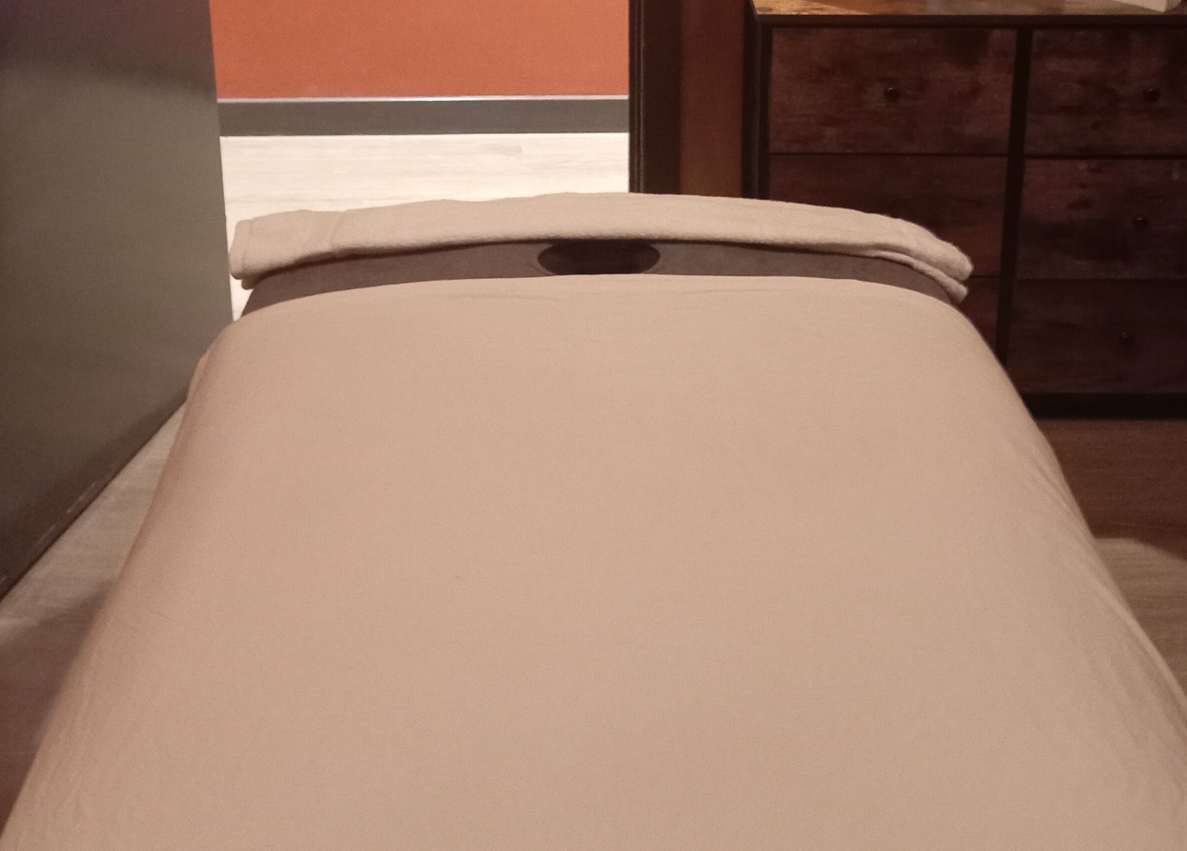 Massage table in a peaceful room at Essential Bodywork by Sara Colautti, Swansea, Wales, GB.