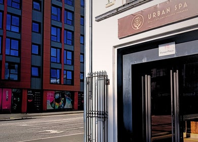 Entrance of Essential Bodywork by Sara Colautti at Swansea, Wales, GB opposite modern blue glass building.