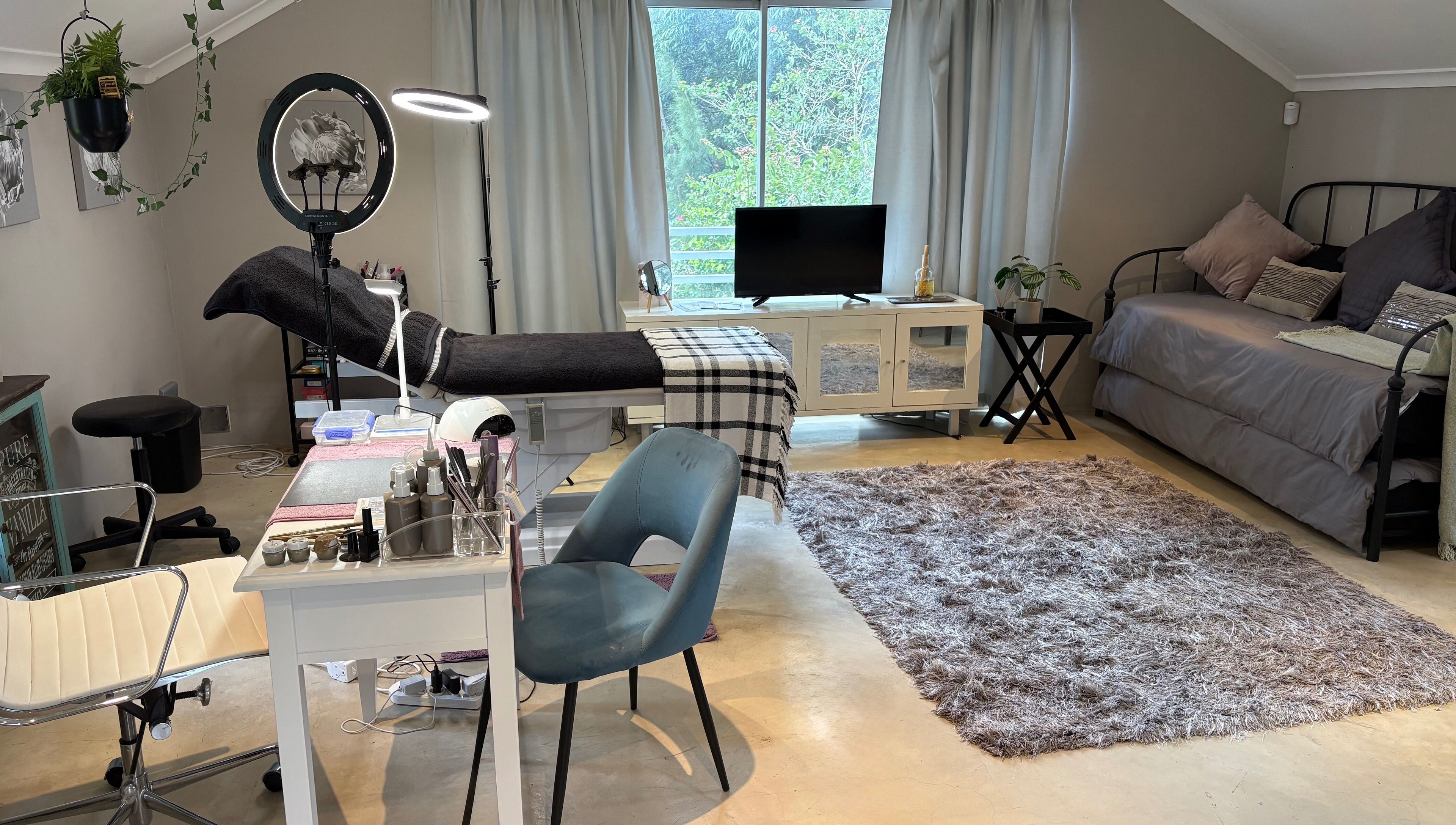 Karmi's beauty treatment room in Somerset West, Western Cape, ZA, featuring plush seating and a serene atmosphere.