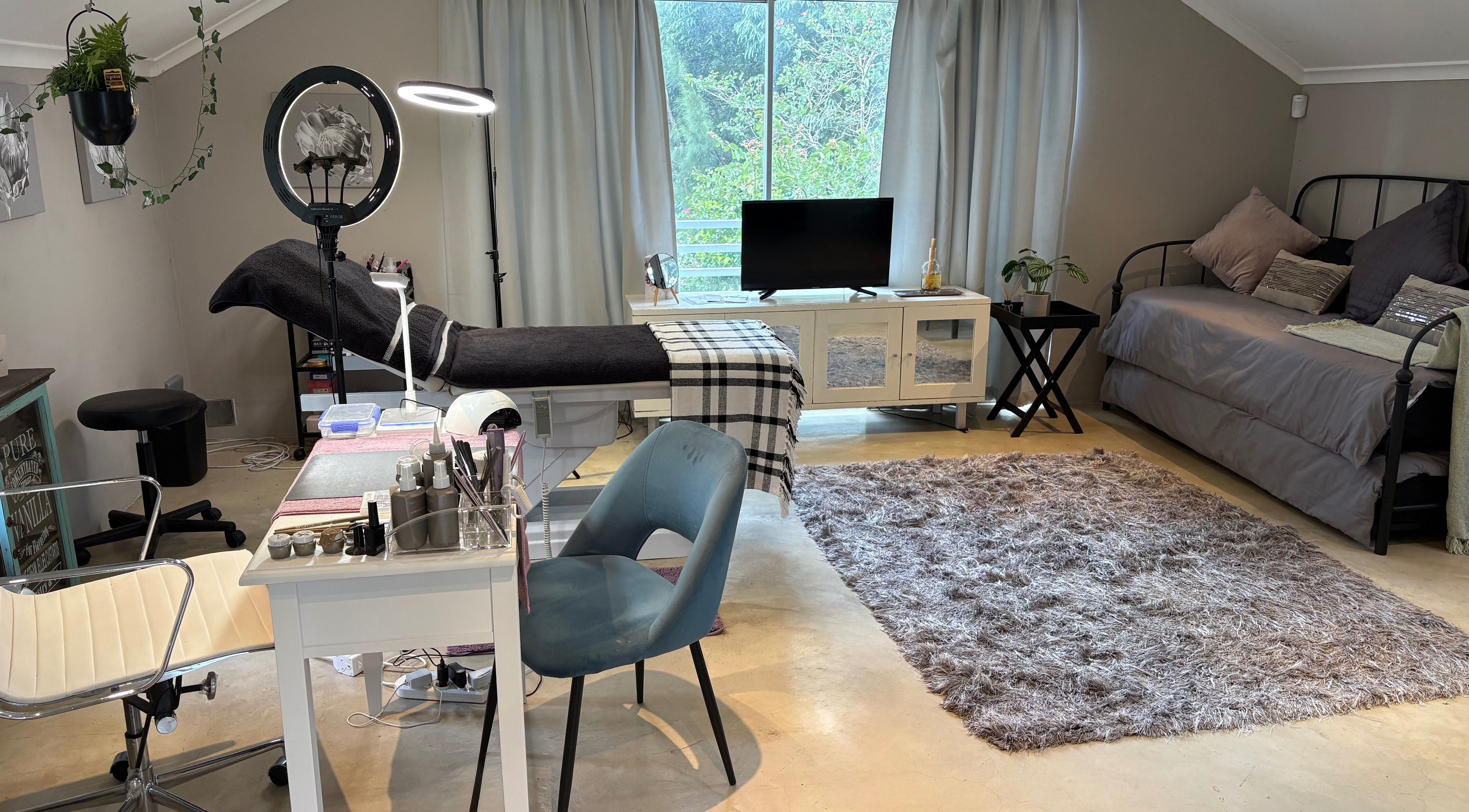 Karmi's beauty treatment room in Somerset West, Western Cape, ZA, featuring plush seating and a serene atmosphere.