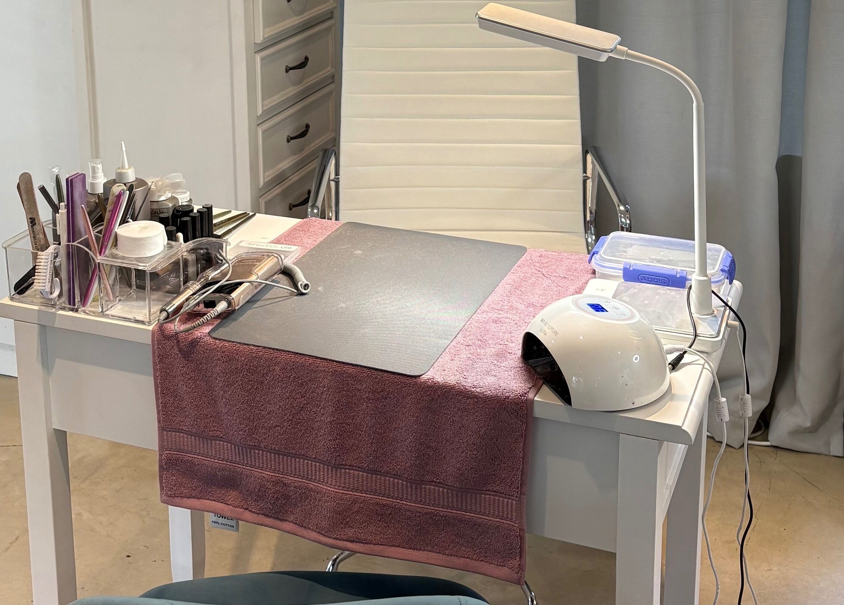 Manicure station at Karmi, Somerset West, Western Cape, ZA, showcasing tools and a cozy setup.