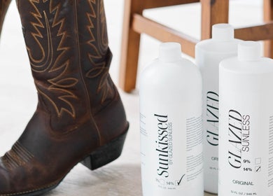 Sunless tanning products at Smile and Glo, Oxford Station, Ontario, CA with stylish boots nearby.