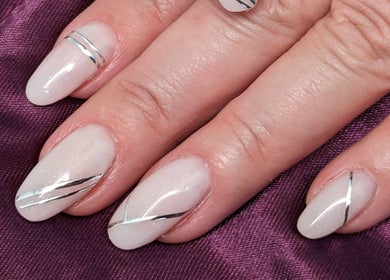 Elegant silver-lined nails at Tetyana's Beauty in Colchester, England, GB for a chic manicure.