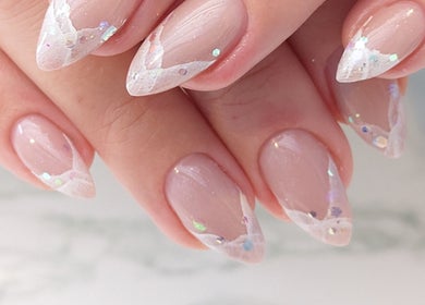 Elegant glittery nails at Tetyana's Beauty, Colchester, England, GB showcasing delicate art.
