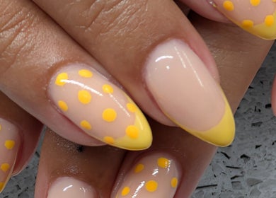 Vibrant yellow polka dot nails at Tetyana's Beauty, Colchester, England, GB.