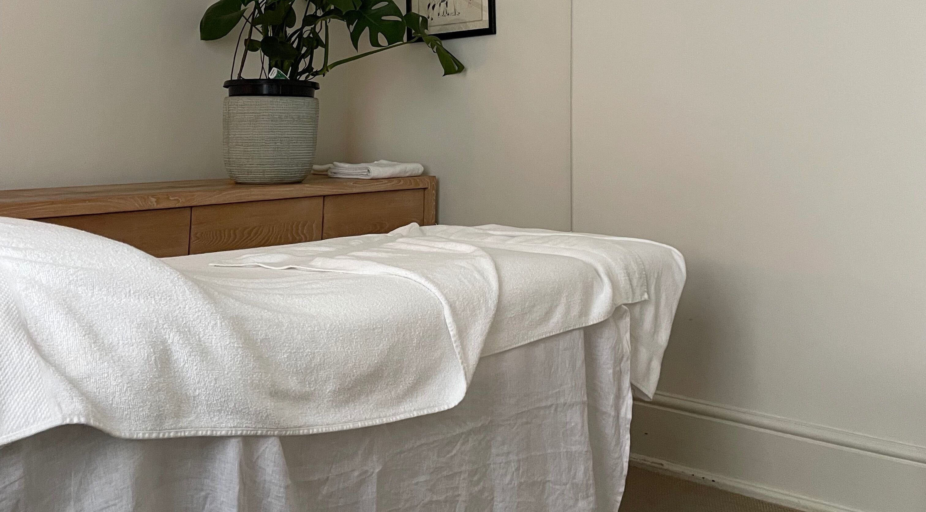 Tranquil massage room at Restoree | Holistic Remedial Massage, Bondi, New South Wales, AU, showcasing a lush plant.