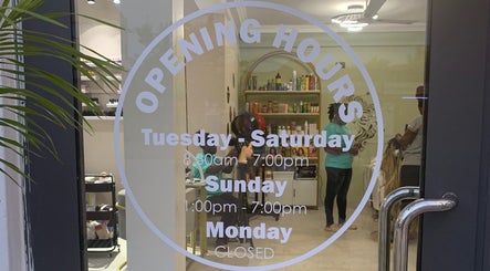 Opening hours of Aurora Beauty Bay in Accra, Greater Accra Region, GH with visible salon interior.