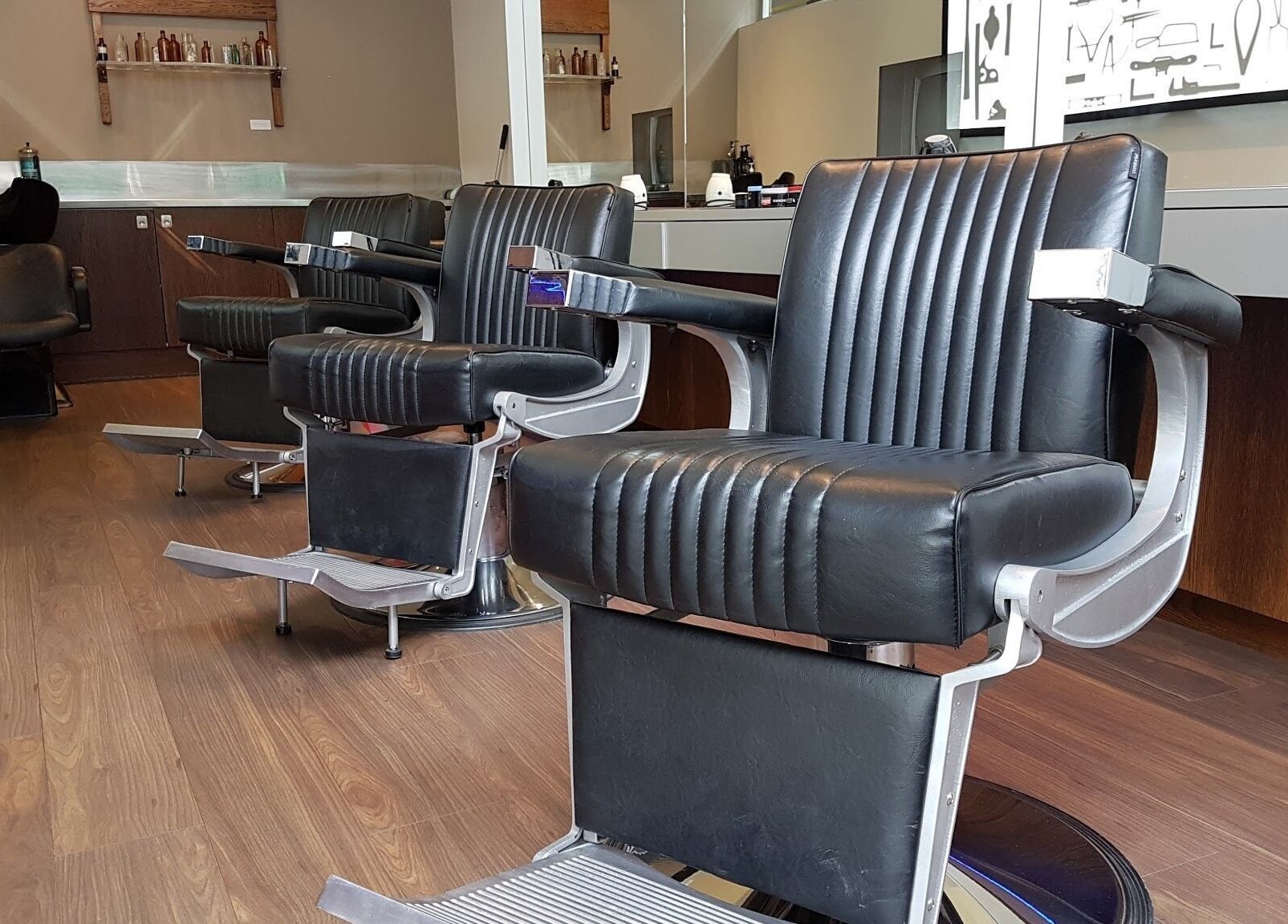 Chic black barber chairs at The Gentry - Shortland Street, Auckland, Auckland, NZ, offering luxury grooming services.