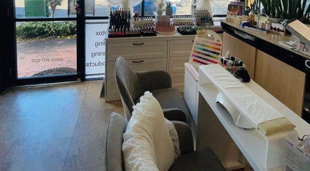 Cozy nail station at Aroma Nail and Beauty, East Brisbane, Queensland, AU with polish display.