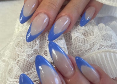 Stylish blue-tipped nails at Aroma Nail and Beauty, East Brisbane, Queensland, AU. Perfect for a chic look.