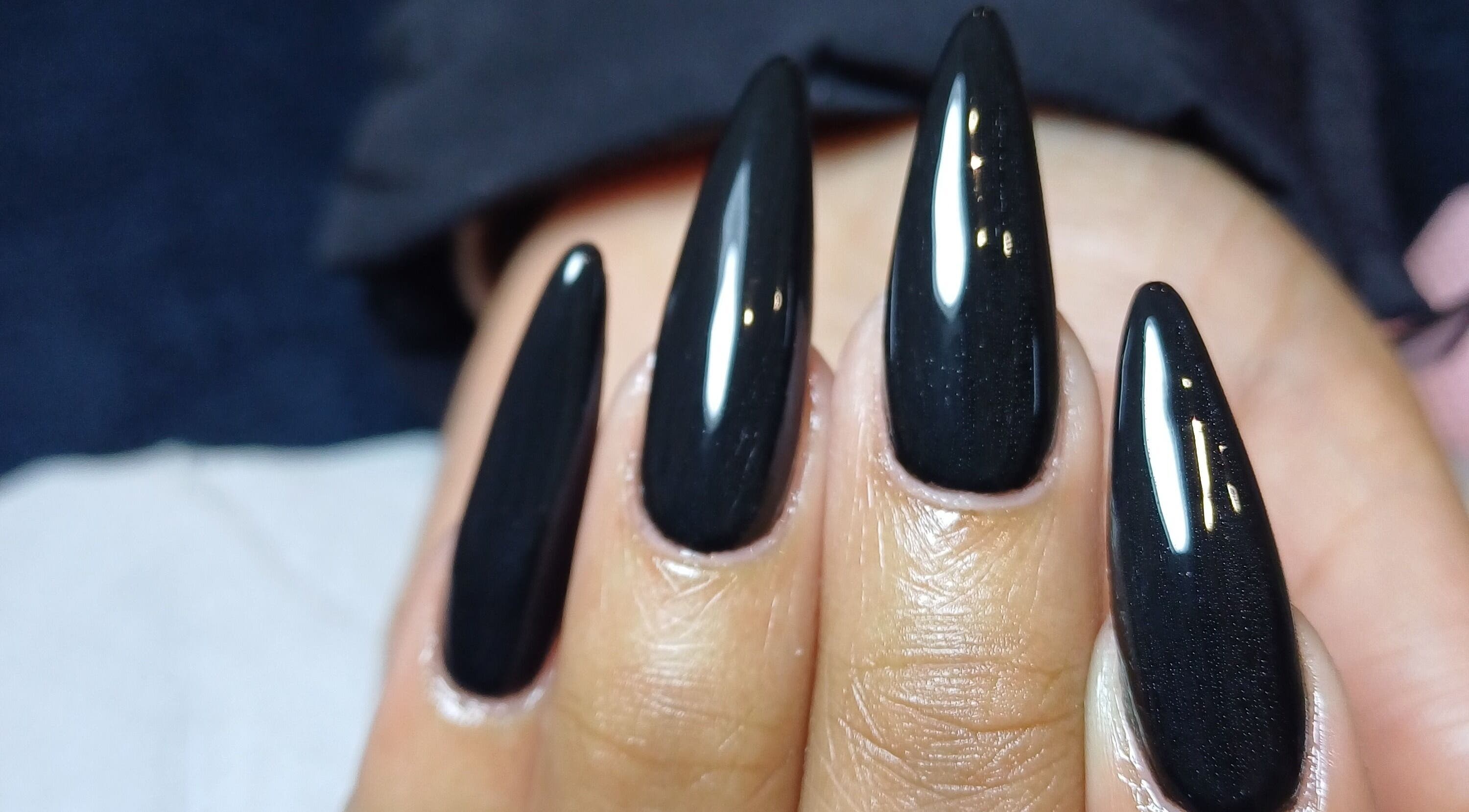 Stylish black nail art at Tinailedit, Cape Town, Western Cape, ZA, showcasing elegant, glossy finish.