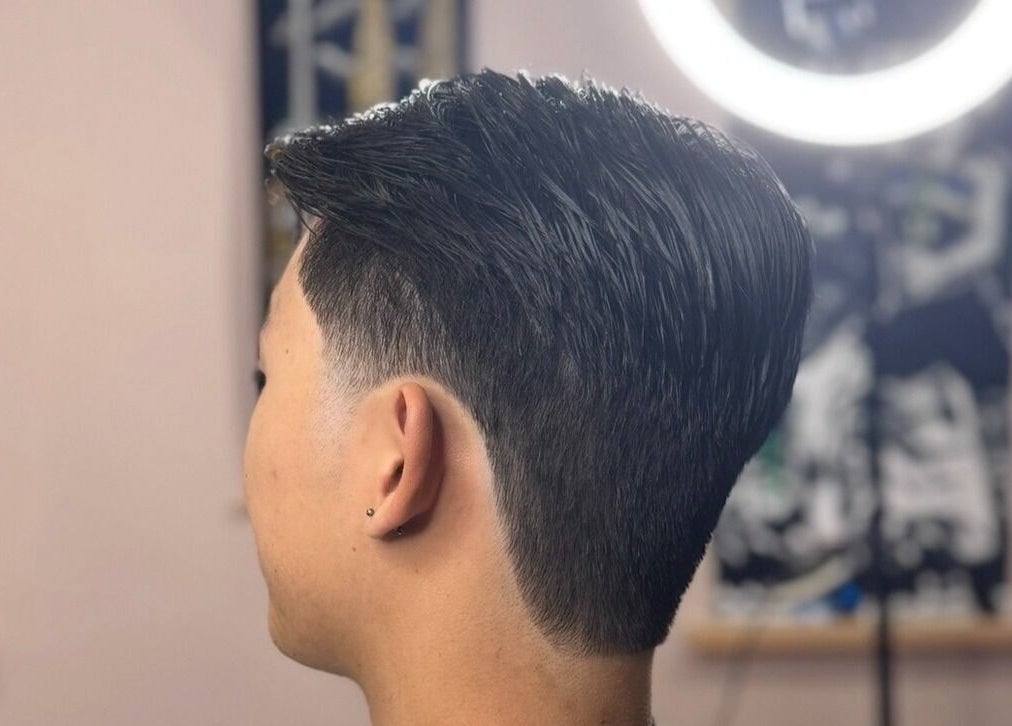 Stylish men's haircut at Scully’s Barbershop in Clarkson, Western Australia, AU, showcasing expert grooming.