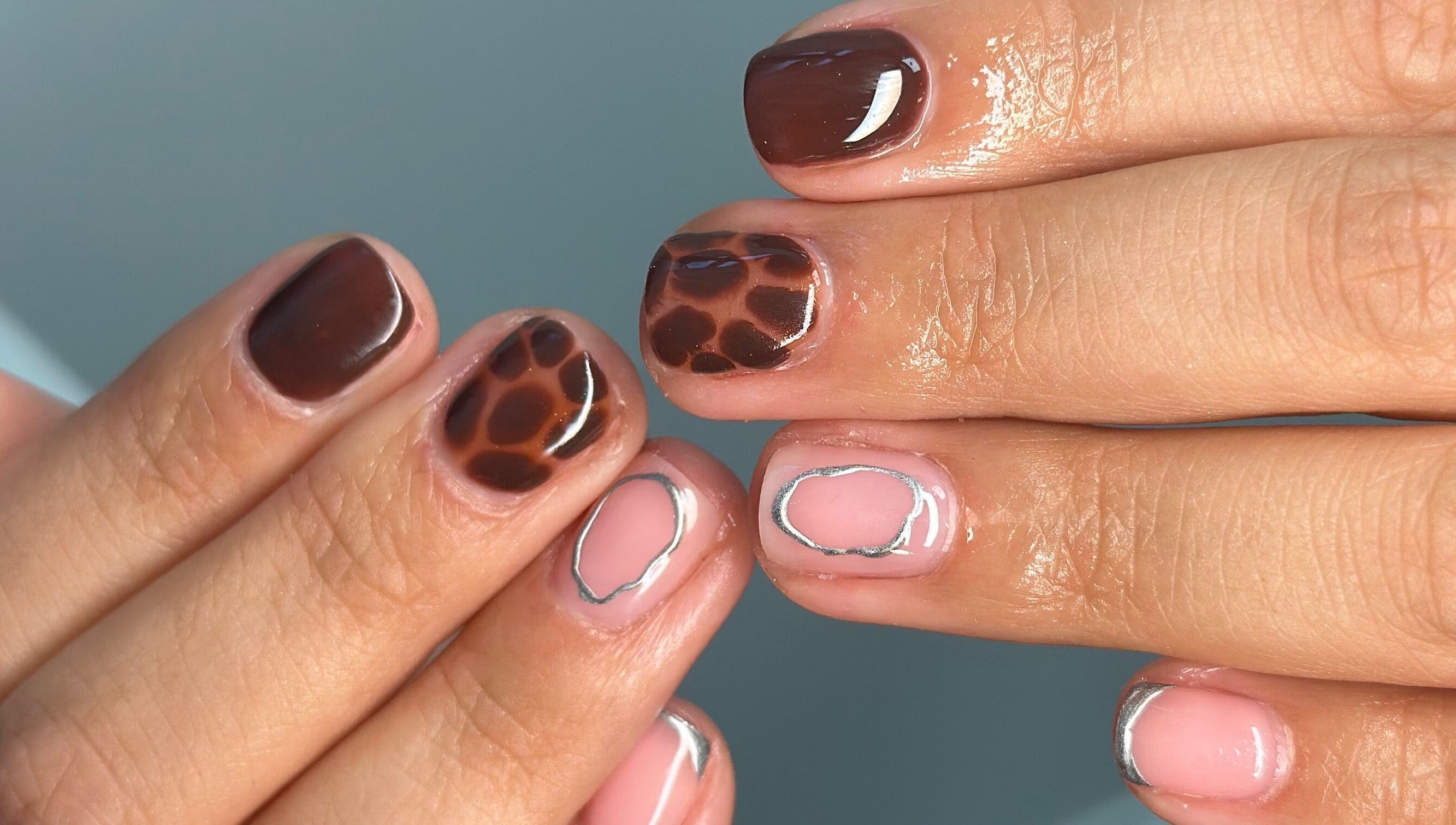 Stylish brown and pink nail design at Manicured By Ella, Halesowen, England, GB.