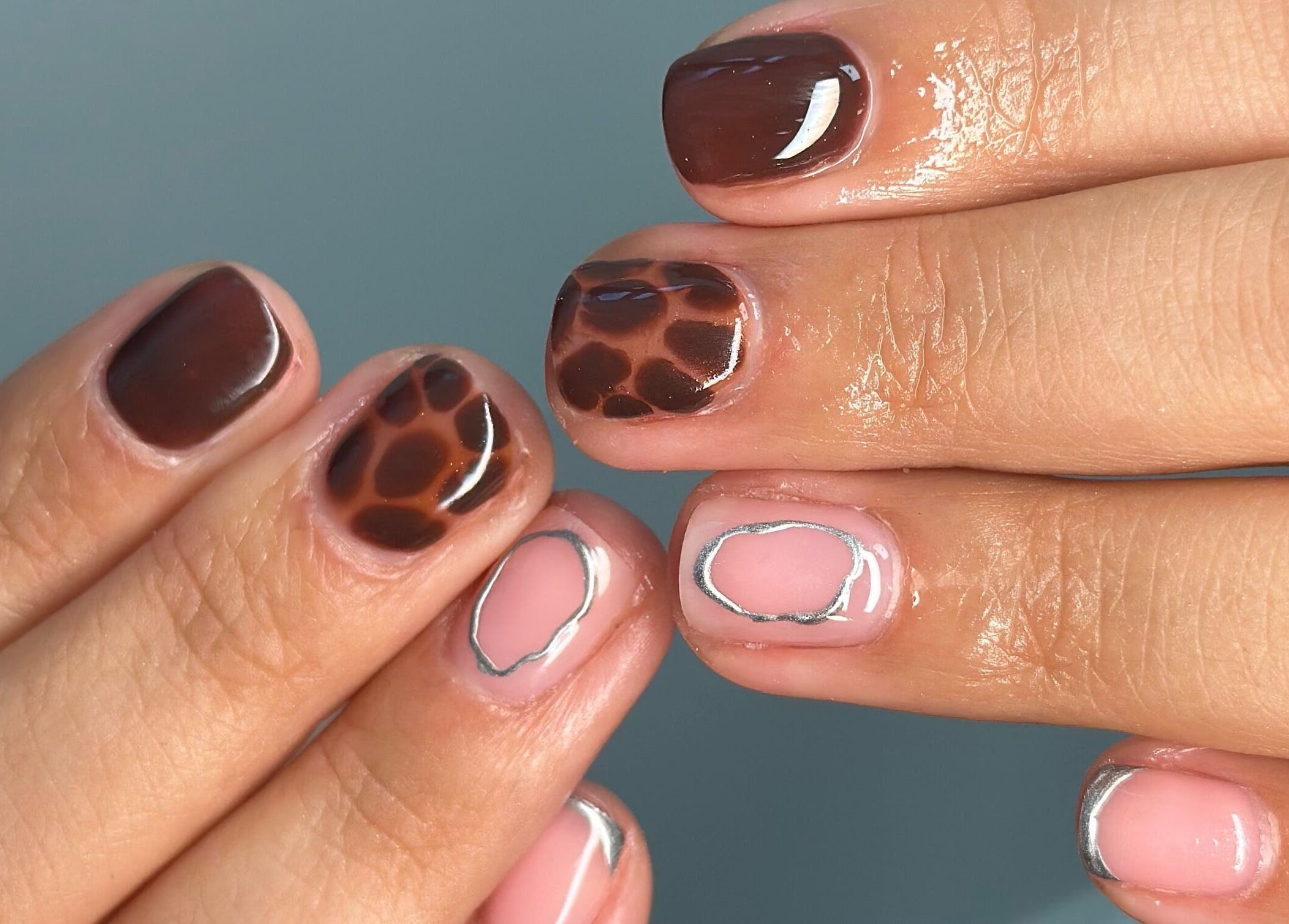 Stylish brown and pink nail design at Manicured By Ella, Halesowen, England, GB.