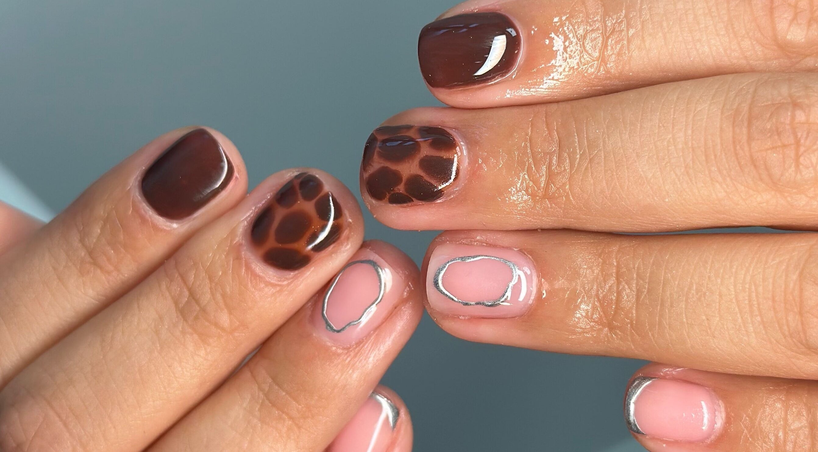 Stylish brown and pink nail design at Manicured By Ella, Halesowen, England, GB.