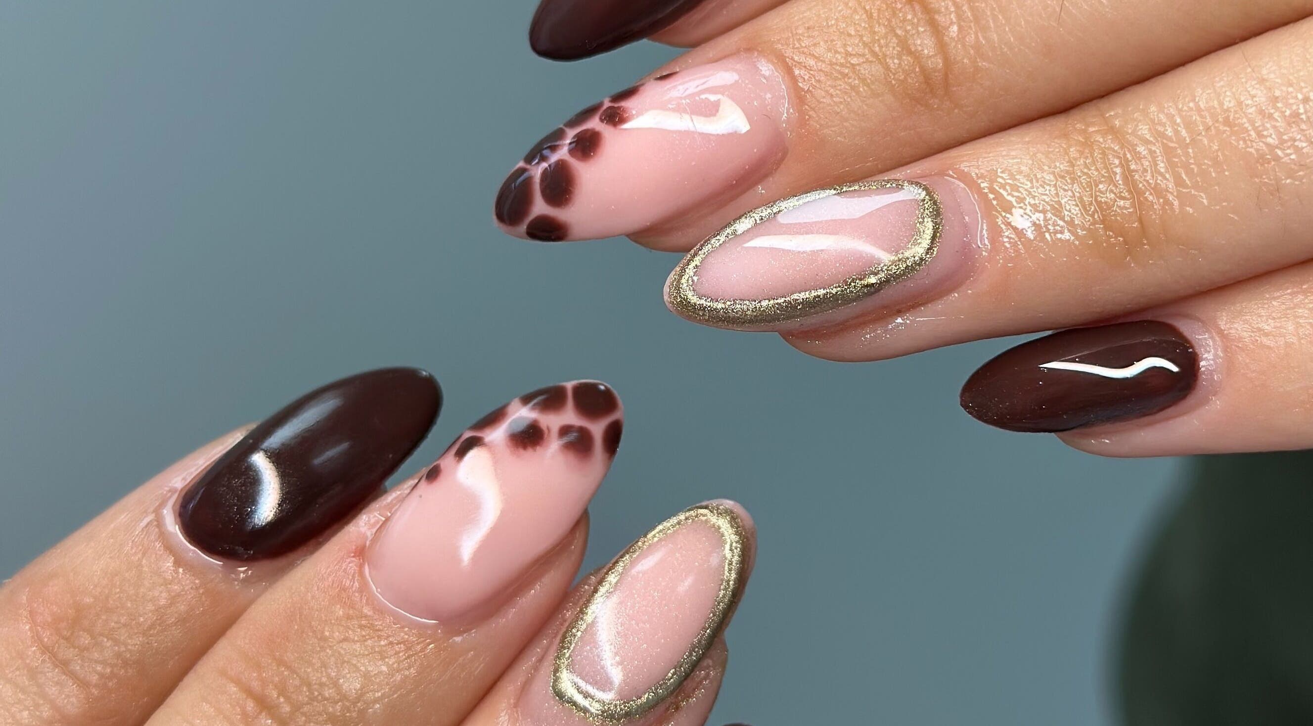 Elegant nail art at Manicured By Ella in Halesowen, England, GB with earthy tones and gold accents.
