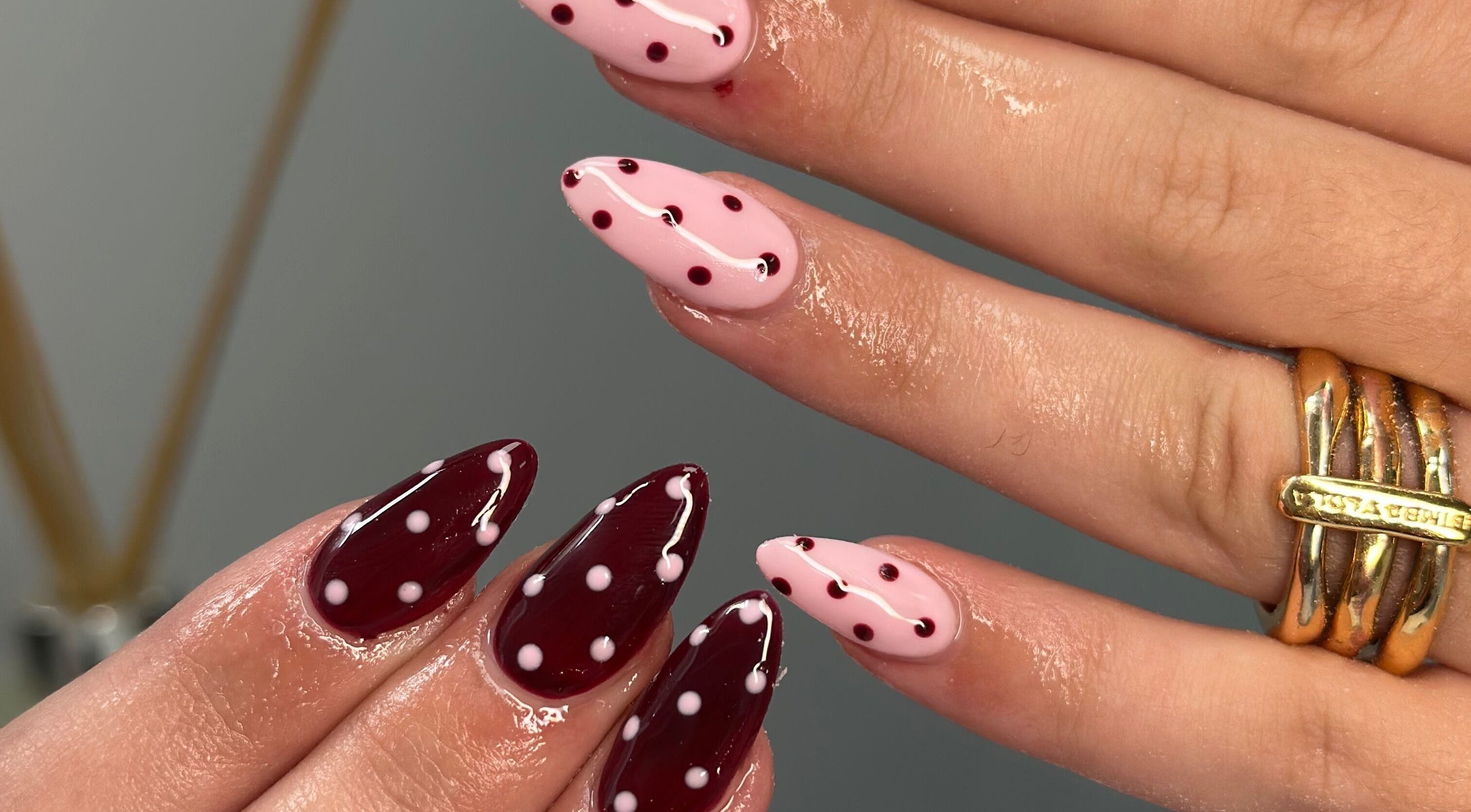 Polka dot nail art by Manicured By Ella, Halesowen, England, GB. Features glossy red and pink designs.