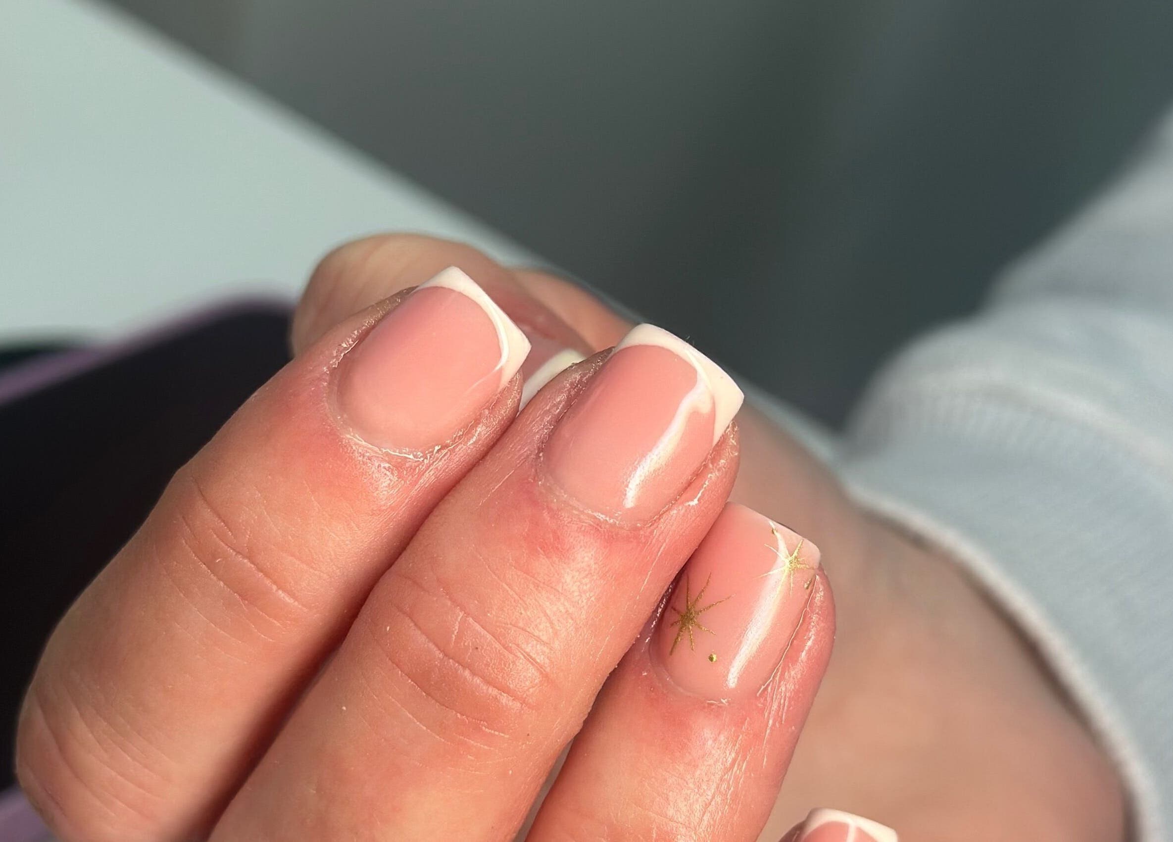 Elegant French manicure with star design at Manicured By Ella, Halesowen, England, GB.