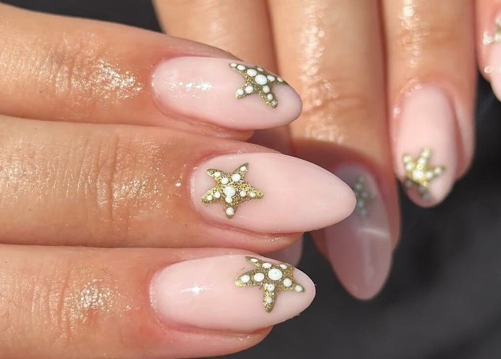 Stylish star-themed nail art by Manicured By Ella in Halesowen, England, GB.