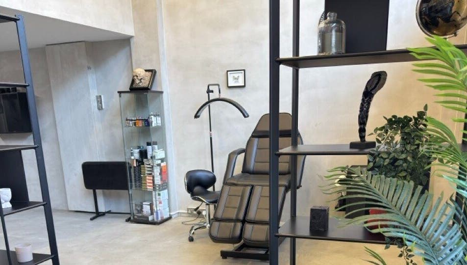 Modern and sleek interior of Ink Story Tattoo, Larnaka, Larnaka, CY showcasing a stylish chair and decor.