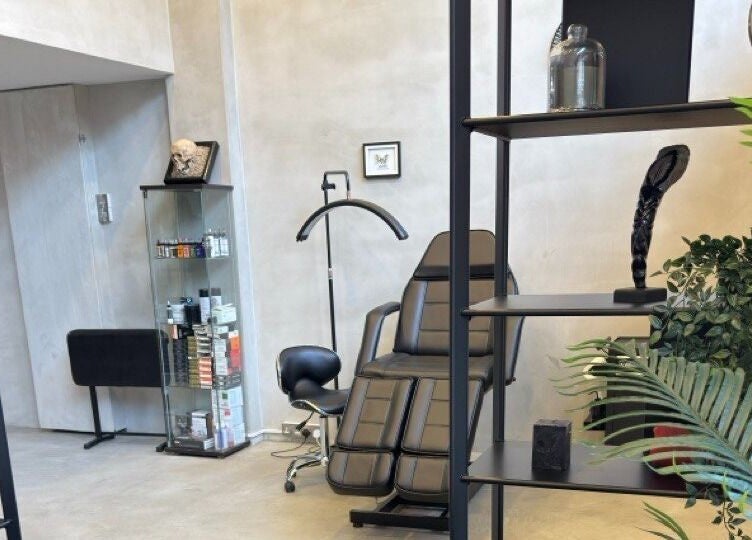 Modern and sleek interior of Ink Story Tattoo, Larnaka, Larnaka, CY showcasing a stylish chair and decor.