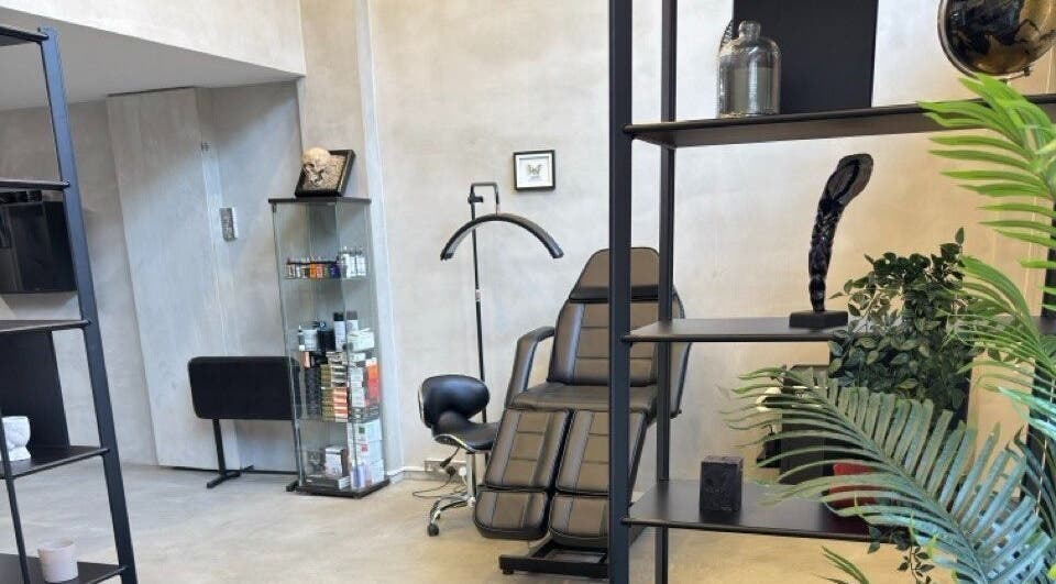 Modern and sleek interior of Ink Story Tattoo, Larnaka, Larnaka, CY showcasing a stylish chair and decor.