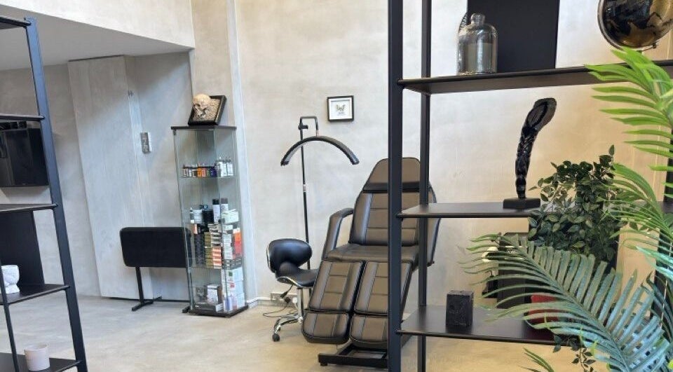 Modern and sleek interior of Ink Story Tattoo, Larnaka, Larnaka, CY showcasing a stylish chair and decor.