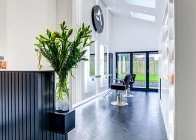 Modern salon interior at Beauty Within Durham, featuring sleek chairs and vibrant decor in Durham, England, GB.