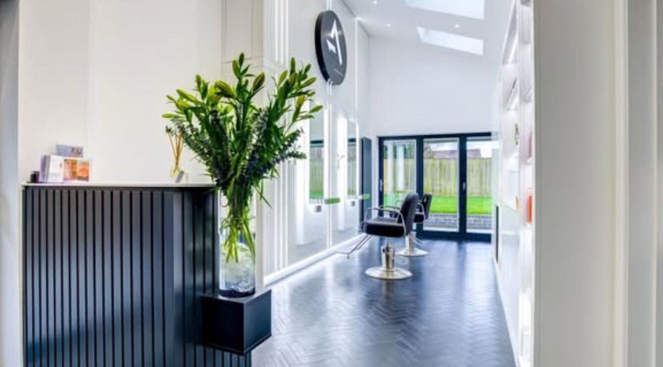 Bright salon interior at Beauty Within Durham, Durham, England, GB, showcasing stylish chairs and modern decor.