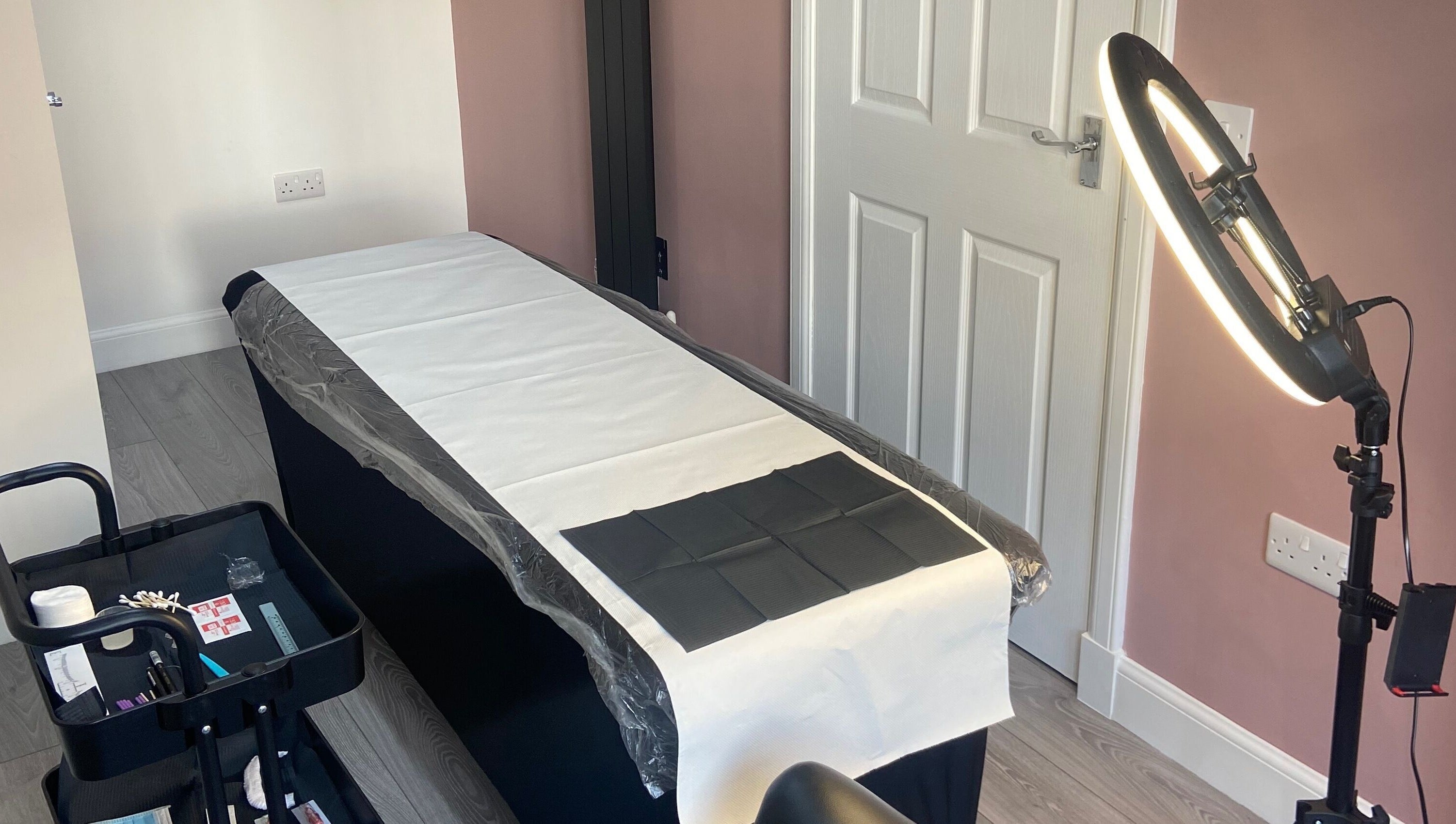 Treatment room at KB Brows and Beauty in Dunbar, Scotland, GB, featuring a treatment bed and professional lighting.