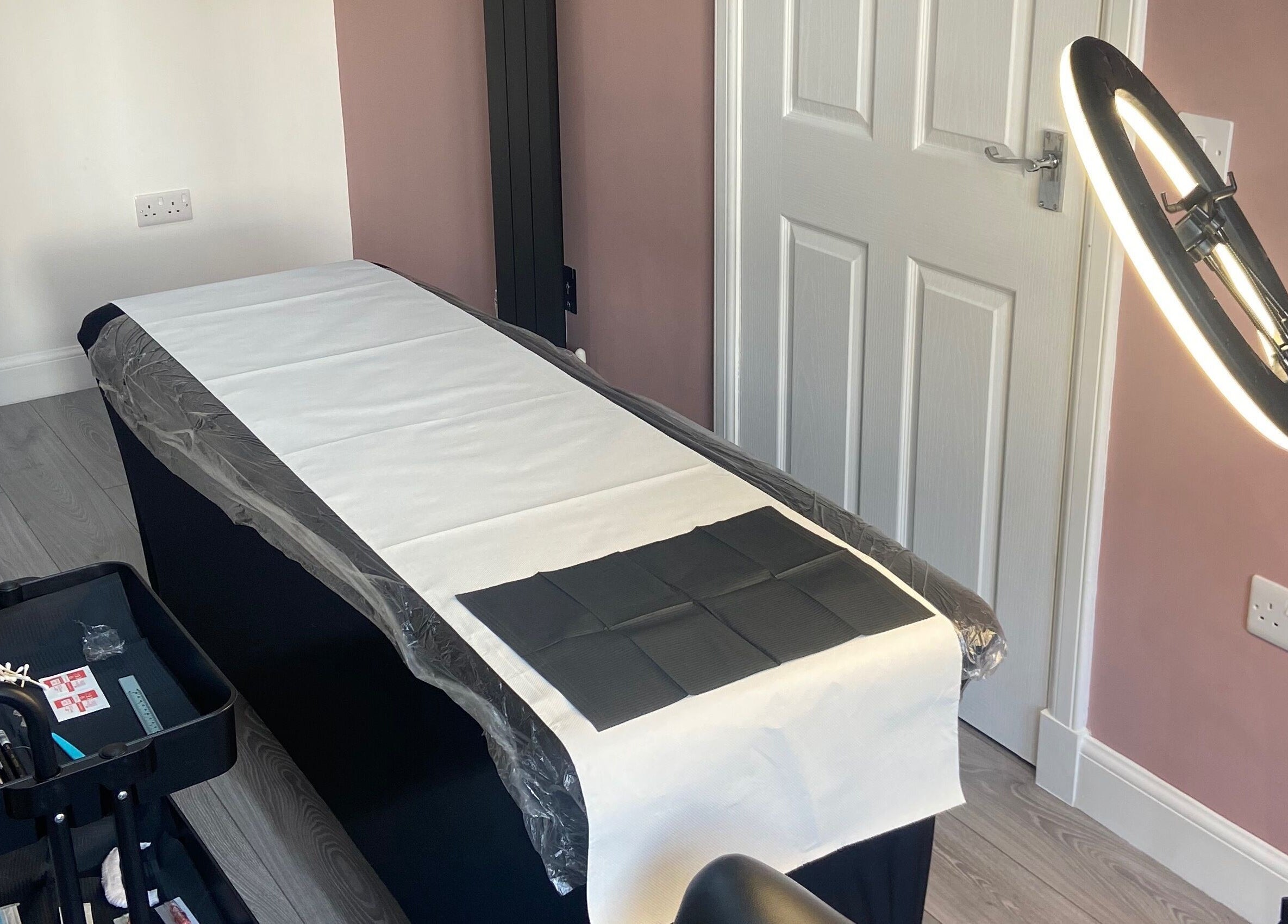 Treatment room at KB Brows and Beauty in Dunbar, Scotland, GB, featuring a treatment bed and professional lighting.