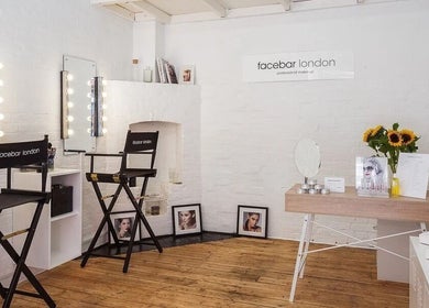 Facebar London makeup studio with chic mirrors and seating, located in London, England, GB.