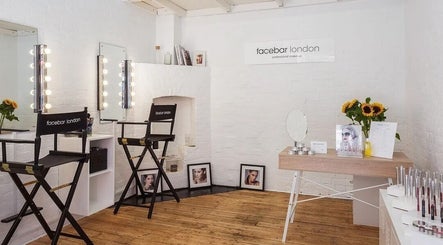 Facebar London makeup studio with chic mirrors and seating, located in London, England, GB.