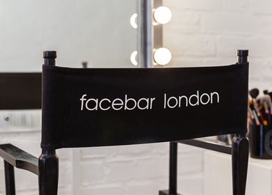 Facebar London makeup chair with vanity mirror in London, England, GB. Elegant beauty setup.