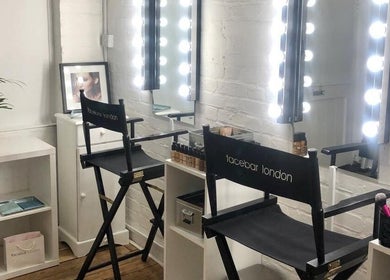 Makeup station at Facebar London with illuminated mirrors and beauty products, located in London, England, GB.