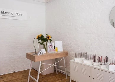 Elegant makeup station at Facebar London with sunflowers and cosmetics, located in London, England, GB.