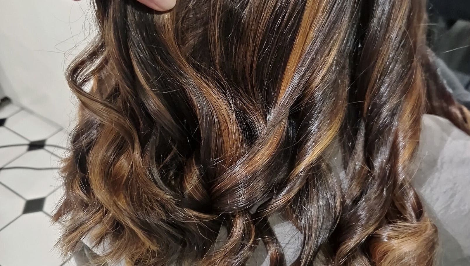 Close-up of elegant wavy hairstyle at Hair by Catherine, Wimborne Minster, England, GB.