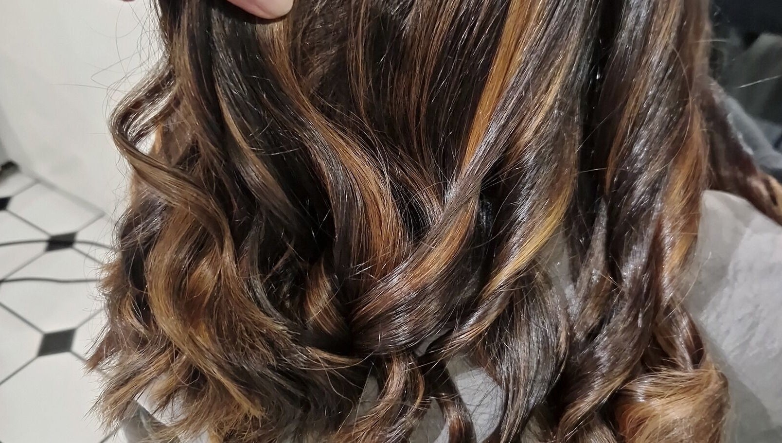 Close-up of elegant wavy hairstyle at Hair by Catherine, Wimborne Minster, England, GB.