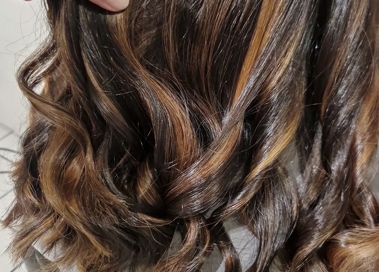 Close-up of elegant wavy hairstyle at Hair by Catherine, Wimborne Minster, England, GB.
