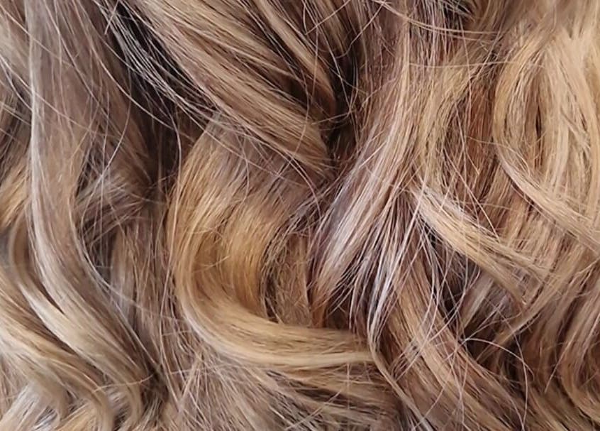 Close-up of lustrous curls styled by Hair by Catherine in Wimborne Minster, England, GB.