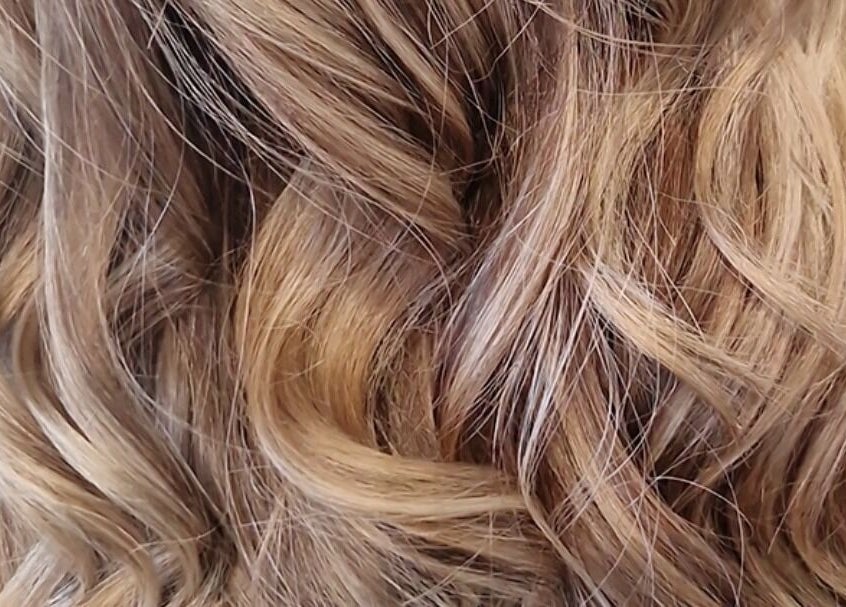 Close-up of lustrous curls styled by Hair by Catherine in Wimborne Minster, England, GB.