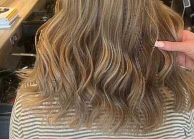 Golden wavy hairstyle at Hair by Catherine in Wimborne Minster, England, GB, showcasing expert hair styling.