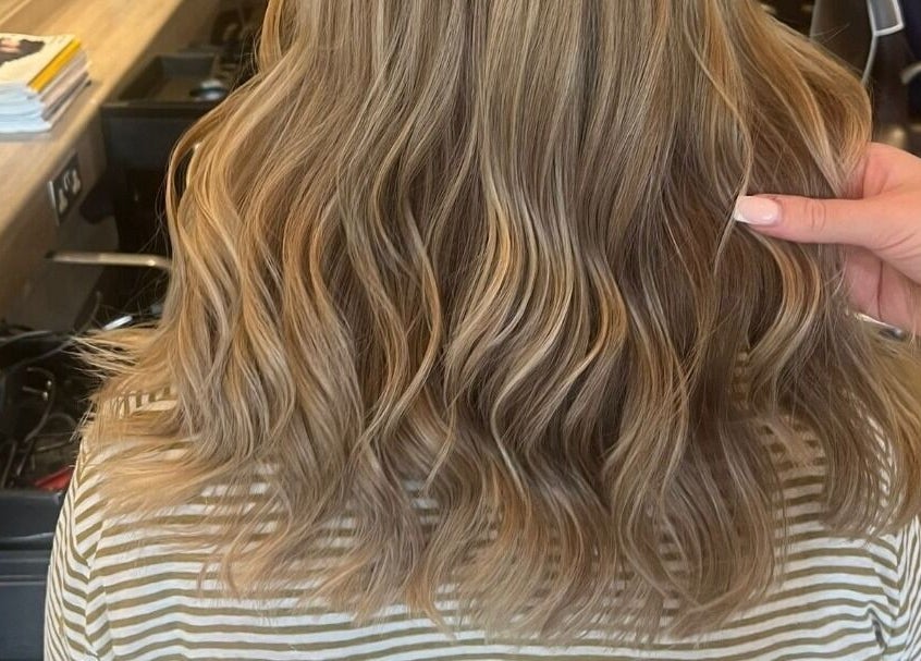 Golden wavy hairstyle at Hair by Catherine in Wimborne Minster, England, GB, showcasing expert hair styling.