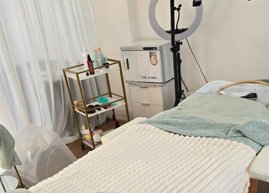 Tranquil beauty treatment room at Lough Skin, Loughborough, England, GB, showcasing cozy setup and equipment.