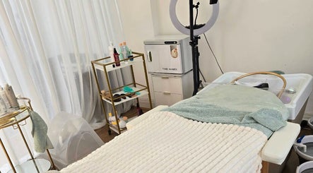 Tranquil beauty treatment room at Lough Skin, Loughborough, England, GB, showcasing cozy setup and equipment.