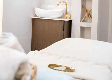 Luxurious treatment room at Lough Skin in Loughborough, England, GB, featuring a cozy massage table and elegant decor.